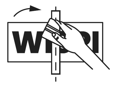 Applying the decal with a squeegee from the center outward